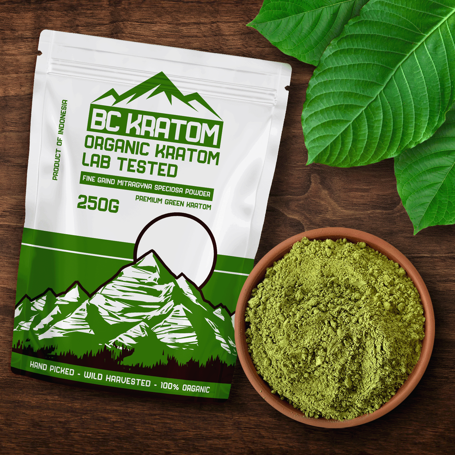 Green BC Kratom Bag laying on a wooden table next to a bowl of Green Kapuas Kratom Powder