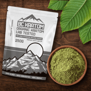 White BC Kratom Bag laying on a wooden table beside a bowl of White Sumatra Kratom Powder